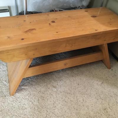 Long rustic wooden bench