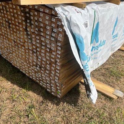 Numerous pallets of lumber 