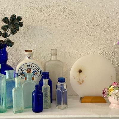 Antique-to-vintage medicine and poison bottles.