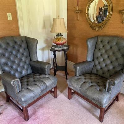 Pair of Leathercraft leather Chippendale-style wing chairs