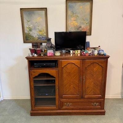Entertainment center, candles, electronics