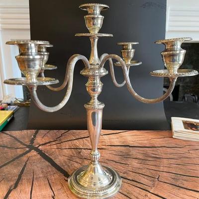 A pair of sterling silver 5 arm candlesticks