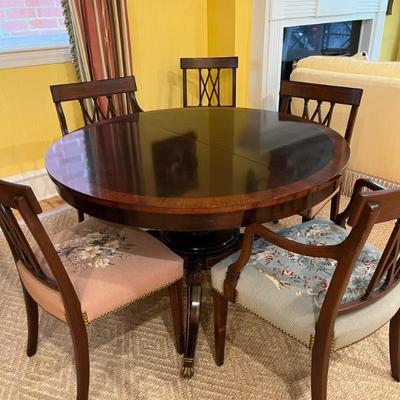 round pedestal dining table with two leaves, mahogany top