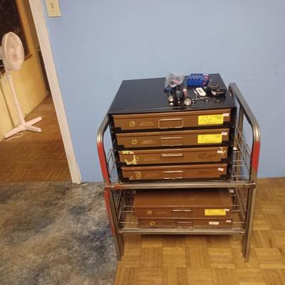 Vintage drawers in holder and sitting on old groceryvdisplay