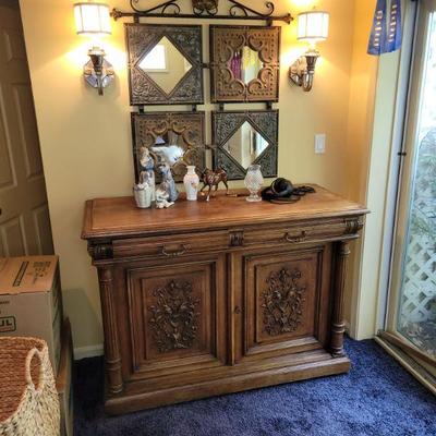 antique carved cabinet, pressed metal mirrors