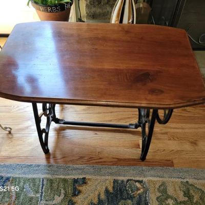 walnut top end table, cast iron base