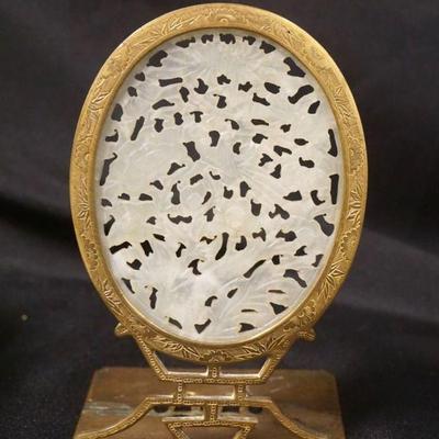 1269	OVAL JADE MEDALLION IN BRASS BOOKEND STAND, APPROXIMATELY 3 1/2 IN X 4 IN X 7 IN HIGH
