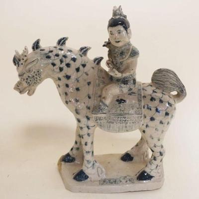 1053	CHINESE POTTERY FIGURE OF MAN SEATED ON HORSE, APPROXIMATELY 4 IN X 12 IN X 12 IN
