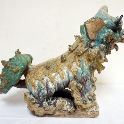 1202	CHINESE LARGE GLAZED TERRACOTTA FOO DOG, APPROXIMATELY 18 IN X 6 IN X 15 IN H
