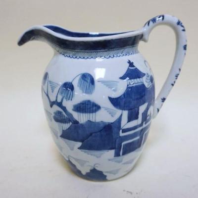 1079	ASIAN BLUE & WHITE POTTERY PITCHER, APPROXIMATELY 8 IN HIGH
