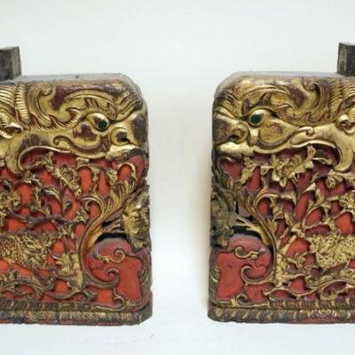 1234	PAIR OF CHINESE CARVED WOOD BLOCKS WITH DRAGON HEAD IMAGES, EACH APPROXIMATELY 12 IN X 3 IN X 14 IN H
