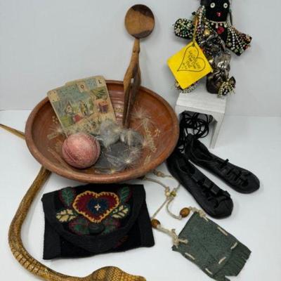 A Collection Of Intriguing Oddities: Voo Doo Doll, Spoon, Toy Snake & More	