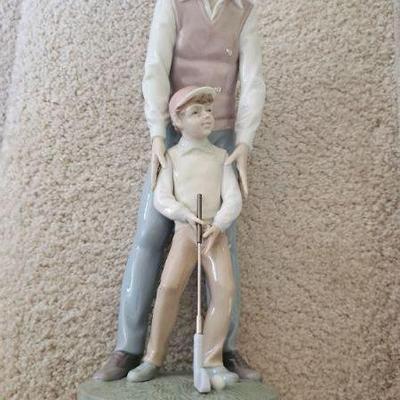 Llardo- Golfer teaching Boy #6609