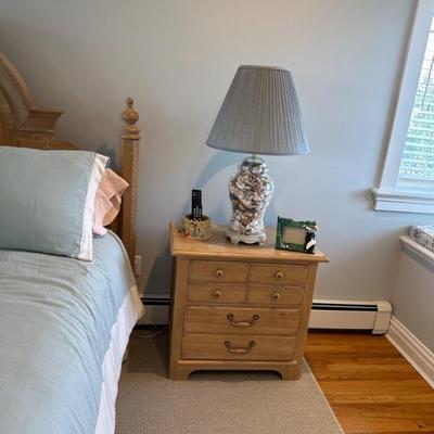 night stand with blue shell lamp