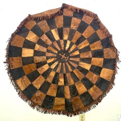 Vtg.African leather hide tribal patchwork mat, diam. 54”