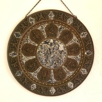 Stamped bronze wall pla