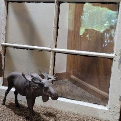 Window & cast iron moose
