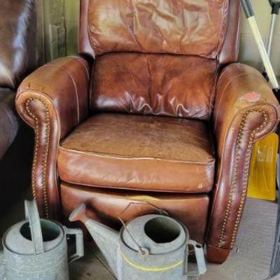 Leather Chair and Water Cans
