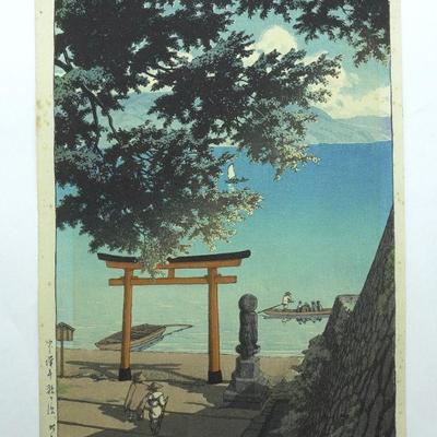Kawase Hasui (1883 - 1957) Woodblock of "Chuzenji Temple at Utagahama Beach". Depicting a temple gate silhouetted against a...