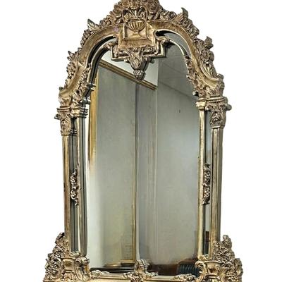 Large Ornate Carved Gilt Mirror. Measures 49"x2"x60" tall.