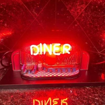 $995. Diner signed sculpture with the unlight
