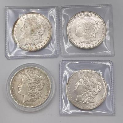 #330 • (4) 1884-1904 Morgan Silver Dollars
