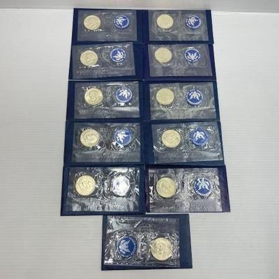 #772 • (11) 1971-1974 Eisenhower Uncirculated 40% Silver Dollars
