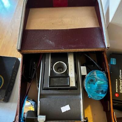 Vintage Polaroid camera with film