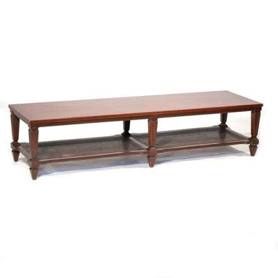 WOOD & CANE COFFEE TABLE | Long rectangular coffee table with carved wood legs and caned & paneled lower shelf. - l. 66 x w. 19 x...