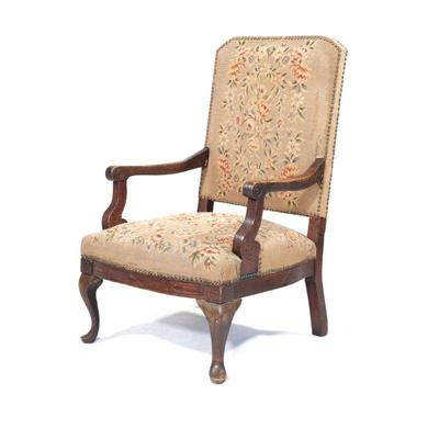 ANTIQUE NEEDLEPOINT FLOWER ARMCHAIR | Carved wood armchair with floral needlepoint upholstery with riveted border over cabriole front...