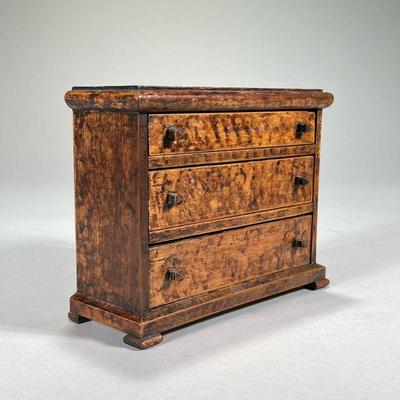 GRAIN-PAINTED MINIATURE CHEST OF DRAWERS | Having three graduated drawers. - l. 7 x w. 3 x h. 6 in

