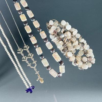 (3PC) COSTUME JEWELRY NECKLACES | Including a necklace with alternating mother of pearl and Baroque, dark mother of pearl links; a chain...