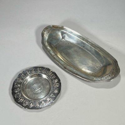 (2PC) STERLING TRAYS | Including a sterling silver Peruvian-made “Moore McCormick Lines” dish with heraldic rim, and a bread tray with...