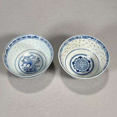 (2PC) CHINESE BLUE & WHITE BOWLS | "Pass through" decorated bowls, one decorated with a tree in the center and marked on...