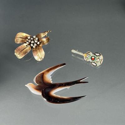 (3PC) COSTUME JEWELRY PINS | Including a carved dove mother of pearl pen, a pho, diamond, lily pin, and an enamel filigree guitar pin. -...