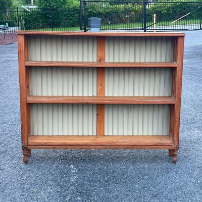 ANTIQUE PINE BOOKCASE | Open sides with X form supports, paneled back. - l. 48 x w. 9 x h. 40 in


