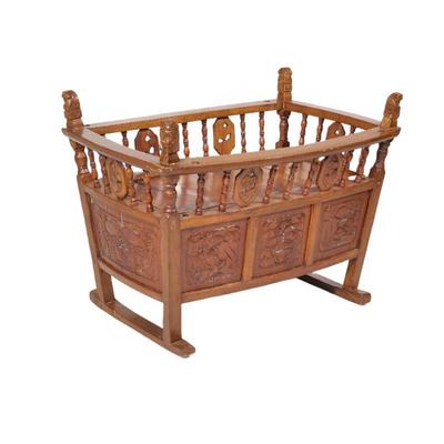 ANTIQUE CARVED OAK BABY CRIB | With intricate carvings, spindle sides. - l. 39.75 x w. 27 x h. 28.5 in

