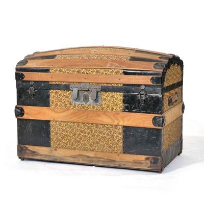 DOME TOP ANTIQUE STORAGE TRUNK | With a rare fitted interior fully intact showing patterned applied paper lining and illustrations,...