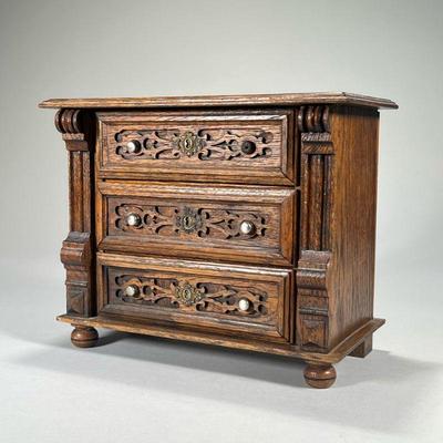 MINIATURE CHEST OF DRAWERS | Having three drawers with blind fretwork. - l. 12 x w. 6 x h. 10 in

