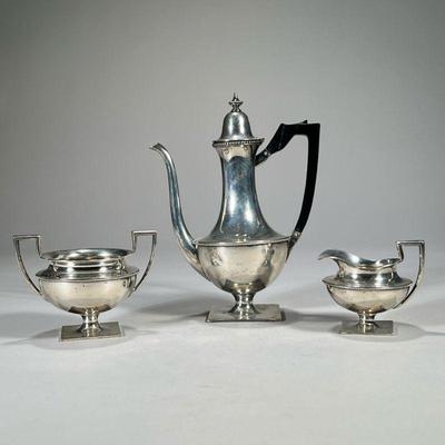 (3PC) WALLACE STERLING SILVER COFFEE SET | Comprising a coffee pot with an ebonized wood handle, an open creamer, and an open...