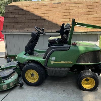 John Deere has snow blower and rotary brush attachment.