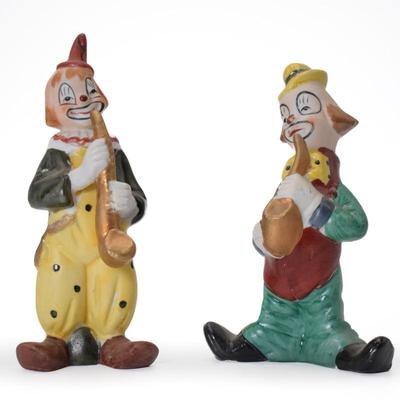 Pair Of Porcelain Hand Painted Clown Figurines Playing Saxophone