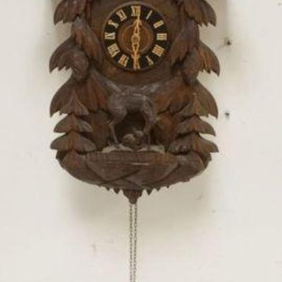 1128	CARVED CUCKOO CLOCK, SOME LOSS TO CARVING, SOLD AS FOUND FOR RESTORATION, APPROXIMATELY 15 IN X 7 IN X 26 IN HIGH
