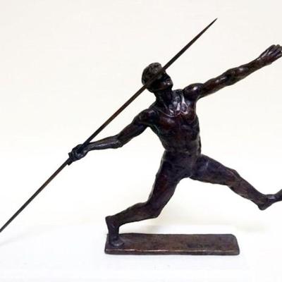 1064	CAST BRONZE IMAGE OF MAN THROWING JAVELIN, APPROXIMATELY 2 IN X 18 IN X 10 IN HIGH, SIGNED KELSEY ON BASE
