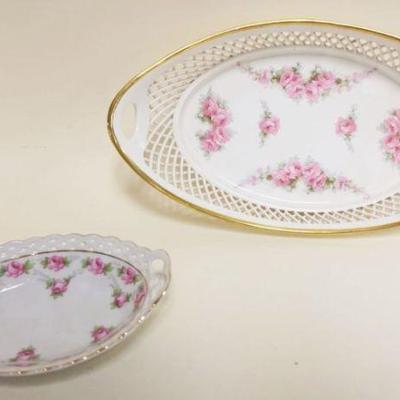 1034	2 CHINA BASKETS W/RETICULATED BORDER, LARGER BASKET W/HAND PAINTED ROSES, APPROXIMATELY 9 1/2 IN X 5 IN X 3 IN HIGH
