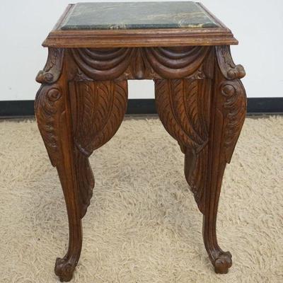 1221	HEAVILY CARVED TABLE WITH GREEN MARBLE INSET TOP, APPROXIMATELY 21 IN X 21 IN X 30 IN H
