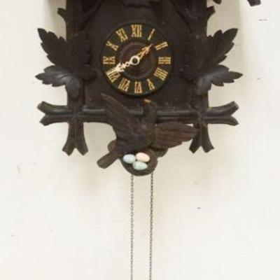1124	CARVED CUCKOO CLOCK, SOME LOSS TO CARVING, SOLD AS FOUND FOR RESTORATION, APPROXIMATELY 14 IN X 8 IN X 20 IN HIGH
