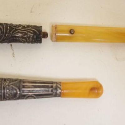 1072	2 ANTIQUE STERLING BANDED CIGAR HOLDERS, ONE SEPARATED
