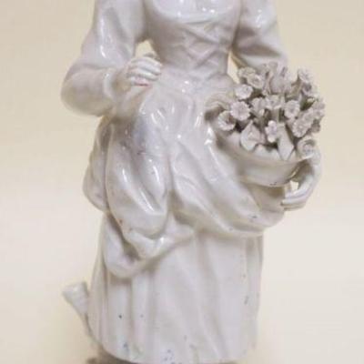 1026	ANTIQUE PORCELAIN FIGURE OF WOMAN CARRYING FLOWER BASKET, CROWN MARK INCISED ON BASE, APPROXIMATELY 10 IN HIGH

