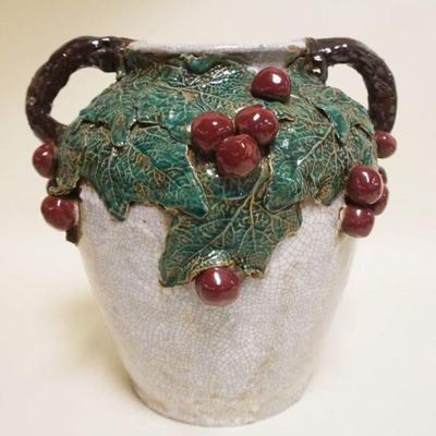 1053	LARGE POTTERY DOUBLE HANDLED VASE W/APPLIED FRUIT & VINES, APPROXIMATELY 12 IN HIGH
